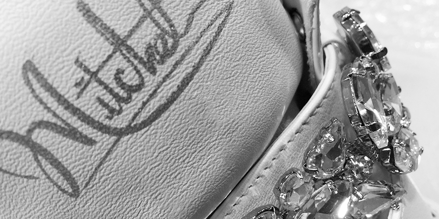 Mitchell signature detail on premium leather with crystal embellishment