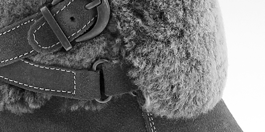 Buckle and shearling detail on a sheepskin boot